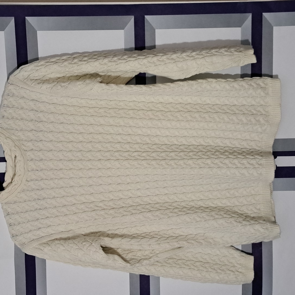 Sweater  Size  Medium. Color is White